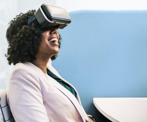 Photo of woman wearing virtual reality headgear